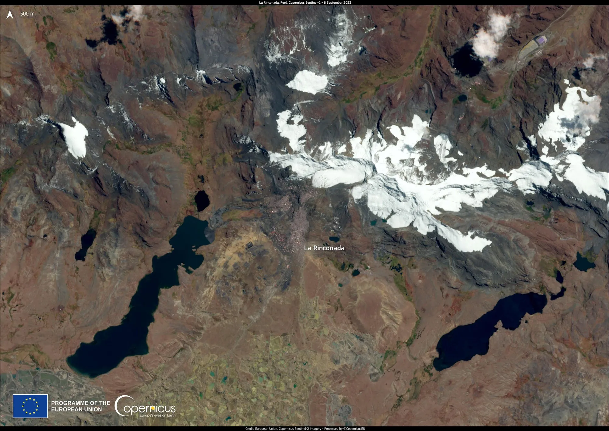 Satellite image showing La Rinconada between glaciers and dark lakes